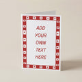 A customizable greeting card standing upright on a neutral beige background. The card has a white center with red placeholder text reading 'ADD YOUR OWN TEXT HERE' and a red border pattern of small hearts.