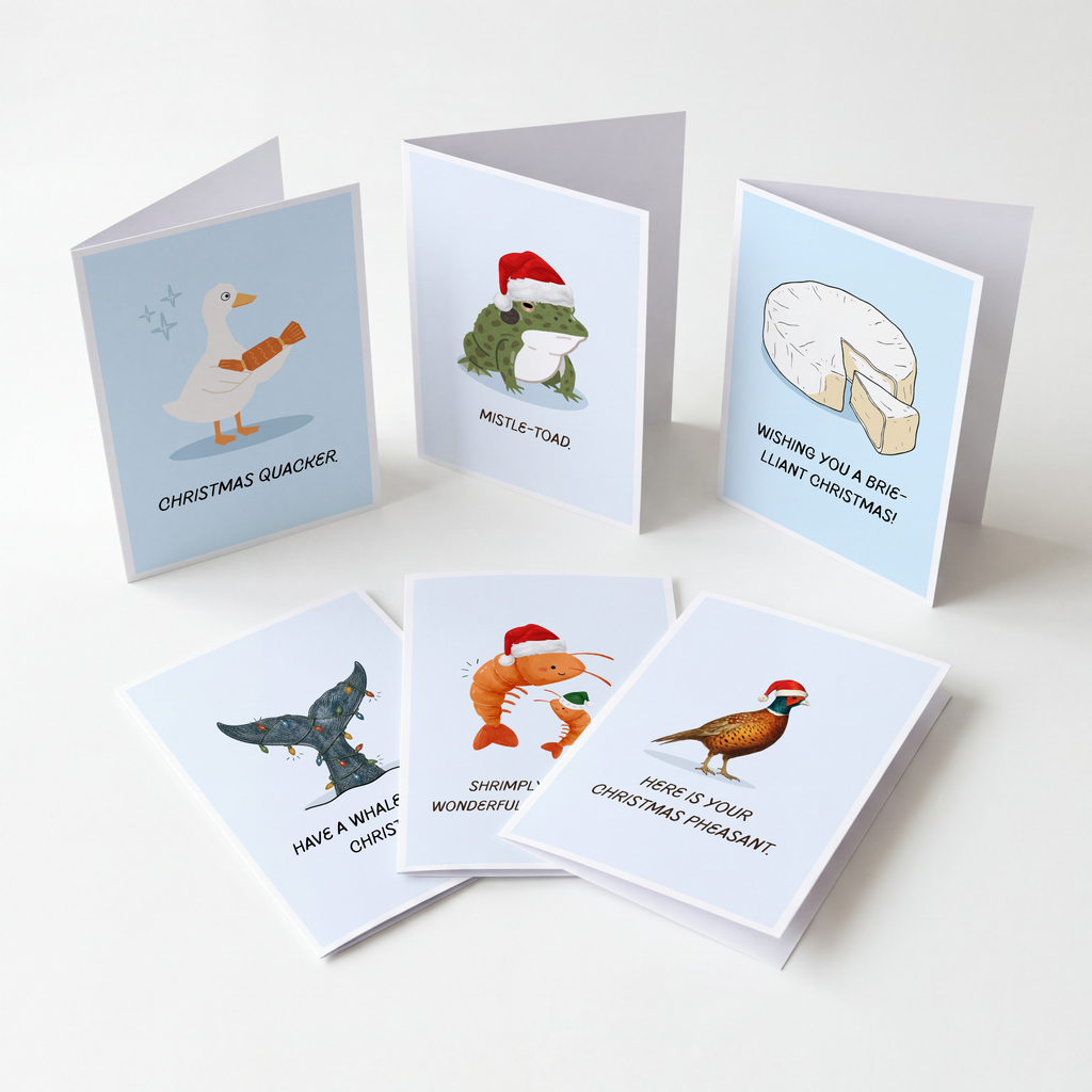 Six Christmas greeting cards arranged on a light neutral background. The cards feature humorous animal illustrations and relative puns underneath.